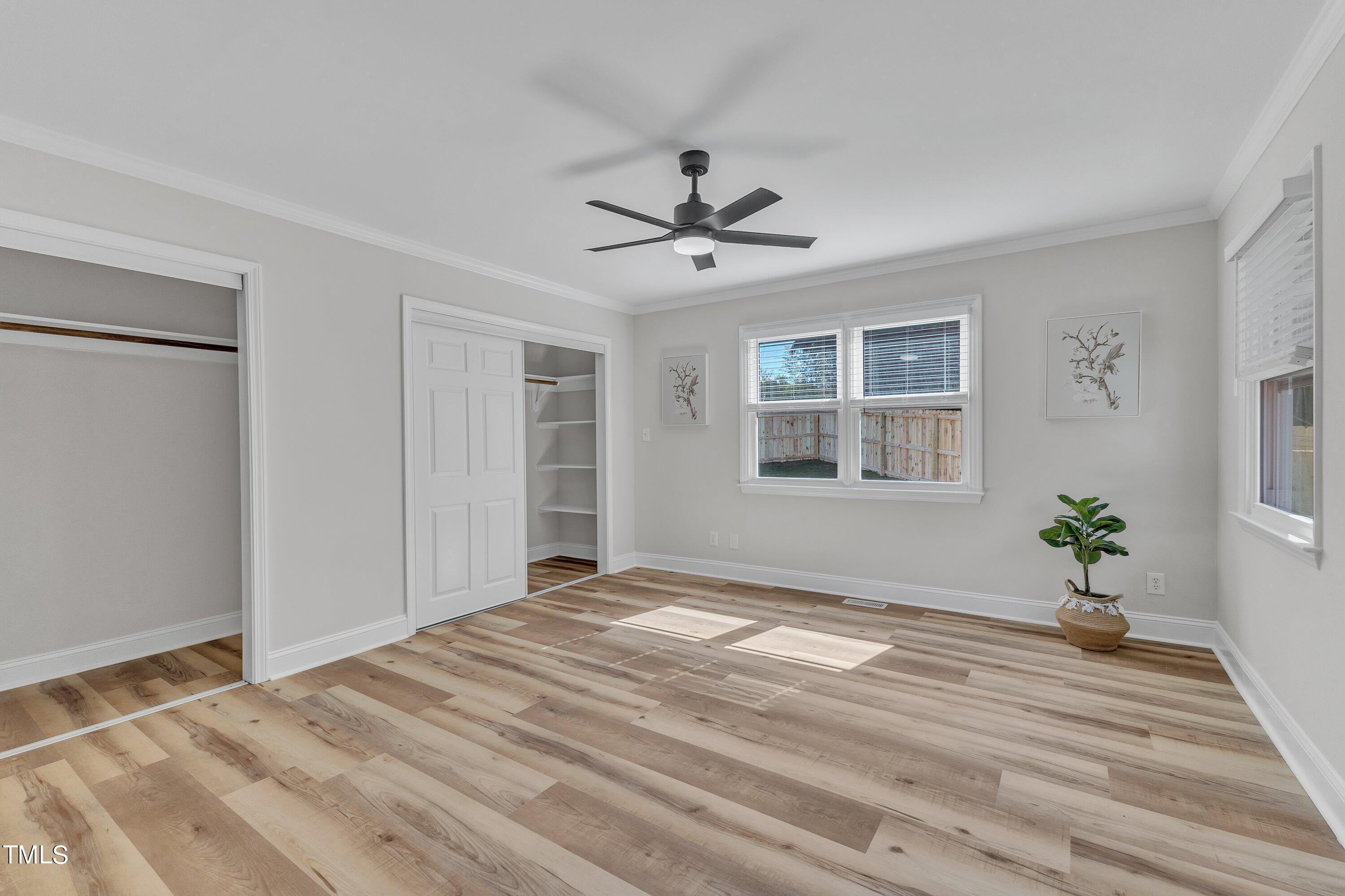 3440 Apache Drive Raleigh, NC 27609 - Photo 23 of 47 a bedroom with a bed and a window