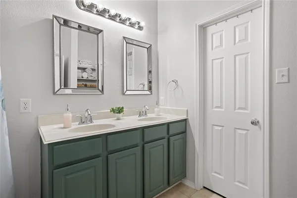 a bedroom with a bed and a cabinets
