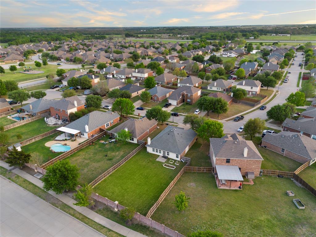 213 Arabian Road Waxahachie, TX 75165 - Photo 18 of 29 Aerial view of property and surrounding area with nearby suburban area
