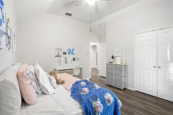 a bedroom with two beds and a table