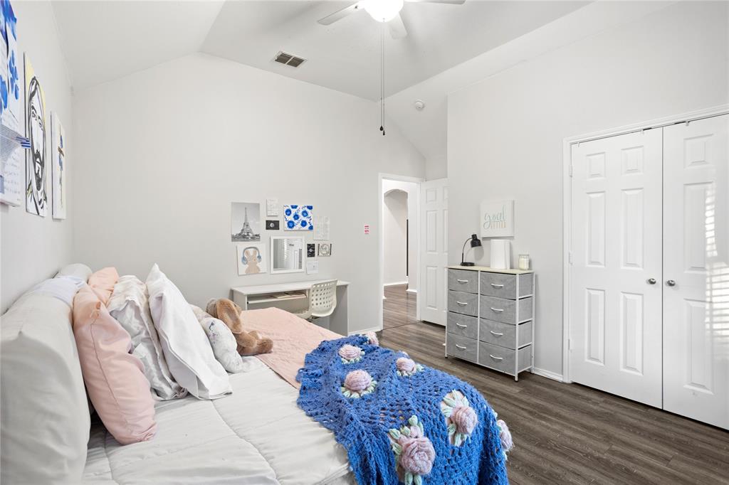 213 Arabian Road Waxahachie, TX 75165 - Photo 22 of 29 Bedroom with lofted ceiling, dark wood-type flooring, a ceiling fan, and a closet