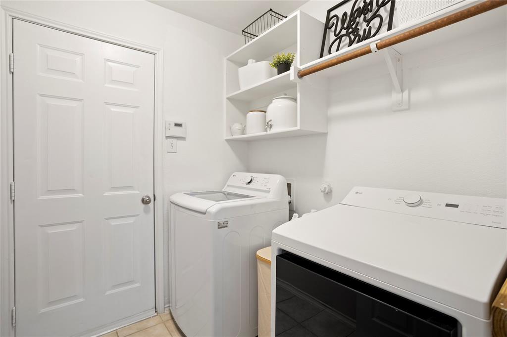 213 Arabian Road Waxahachie, TX 75165 - Photo 24 of 29 Laundry area with separate washer and dryer and light tile patterned flooring