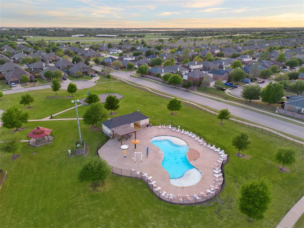 213 Arabian Road Waxahachie, TX 75165 - Photo 26 of 29 Aerial perspective of suburban area featuring a pool