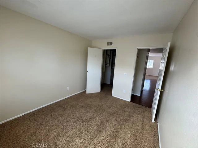 an empty room with a mirror