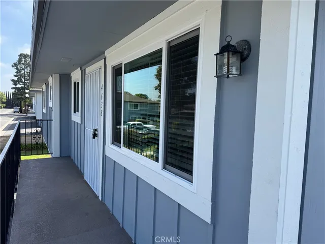 a view of a hallway and a livingroom view