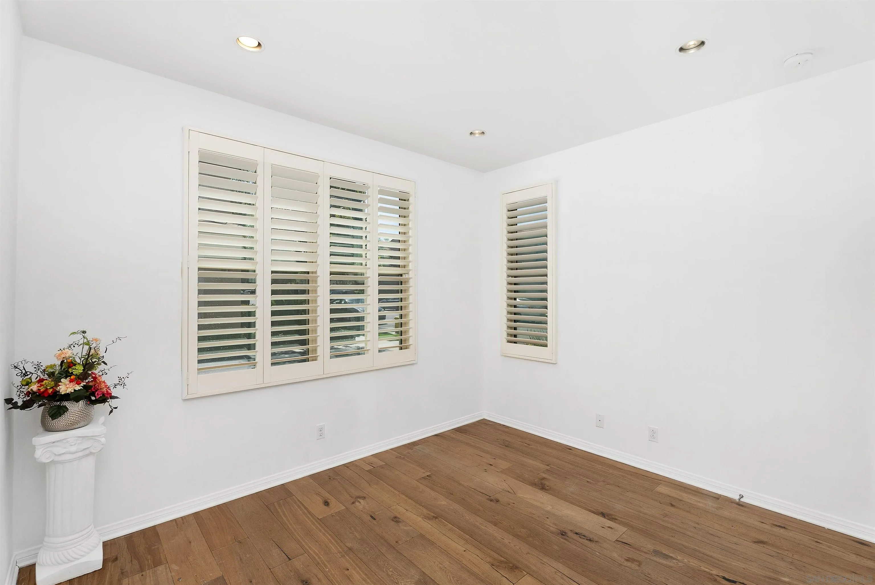 55 Diamond Irvine, CA 92620 - Photo 13 of 30 a view of an empty room with wooden floor and a window