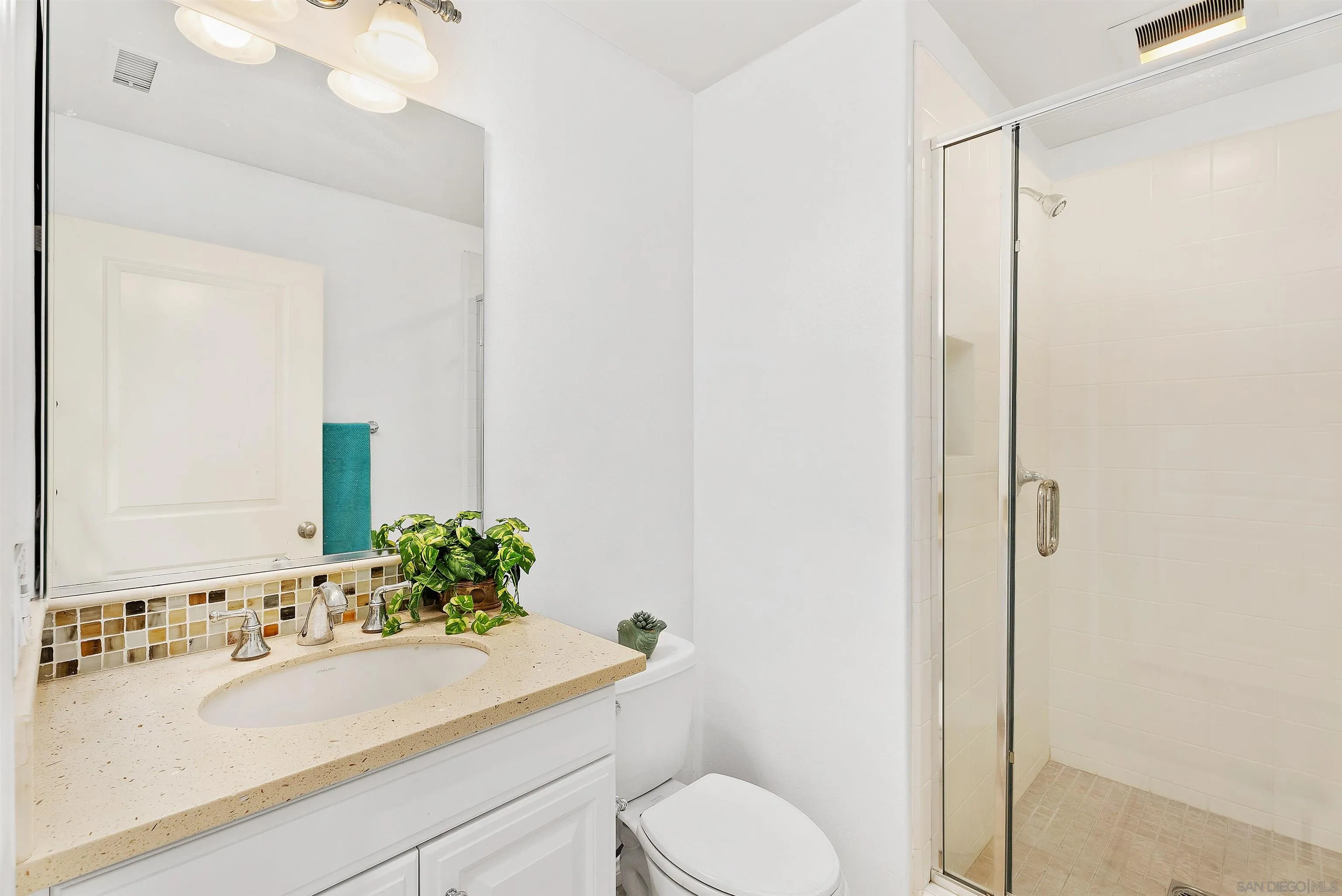 55 Diamond Irvine, CA 92620 - Photo 14 of 30 a bathroom with a sink toilet and mirror