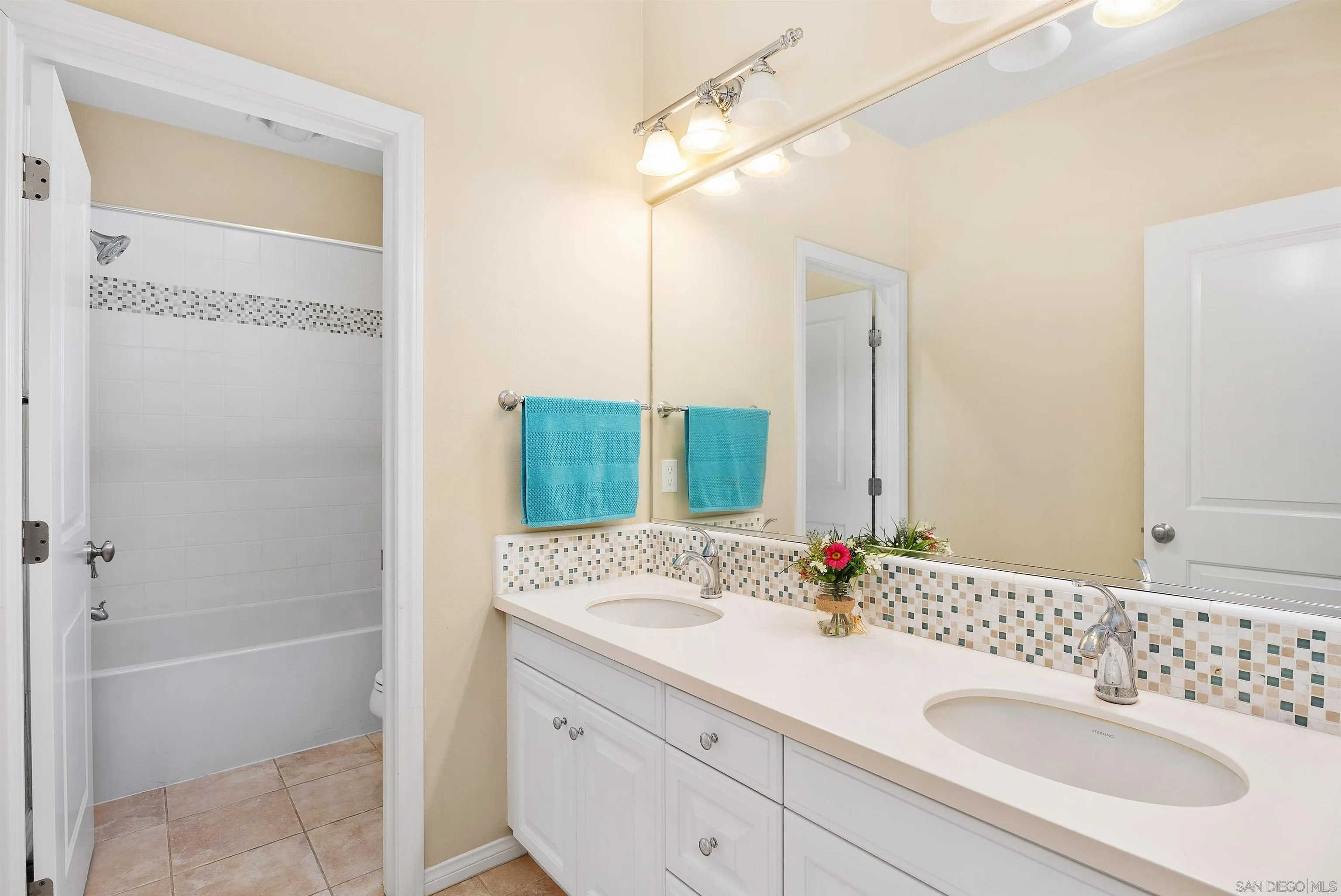 55 Diamond Irvine, CA 92620 - Photo 22 of 30 a bathroom with a sink vanity granite tub shower and a mirror