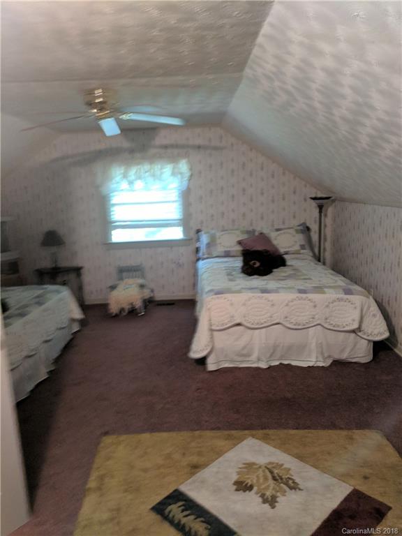 127 Dolan Lane, Unit 8338 Clyde, NC 28721 - Photo 11 of 21 a bedroom with a bed and window
