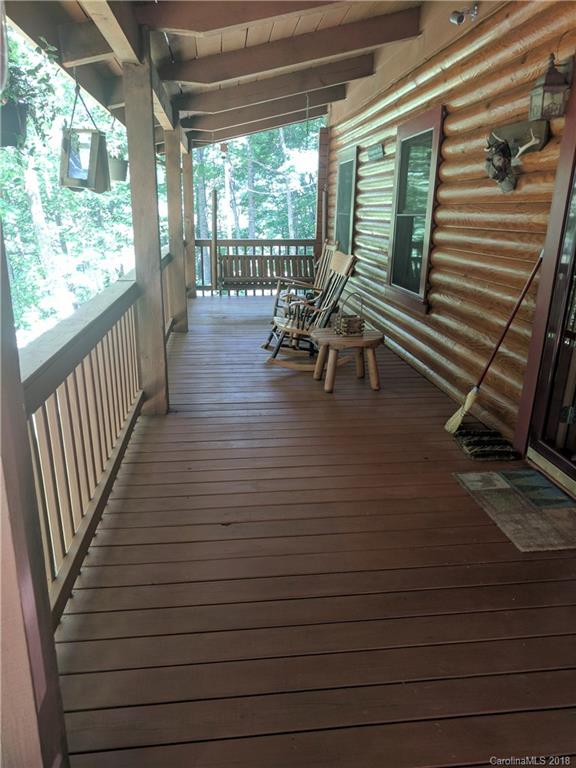 127 Dolan Lane, Unit 8338 Clyde, NC 28721 - Photo 13 of 21 a view of a porch with wooden floor