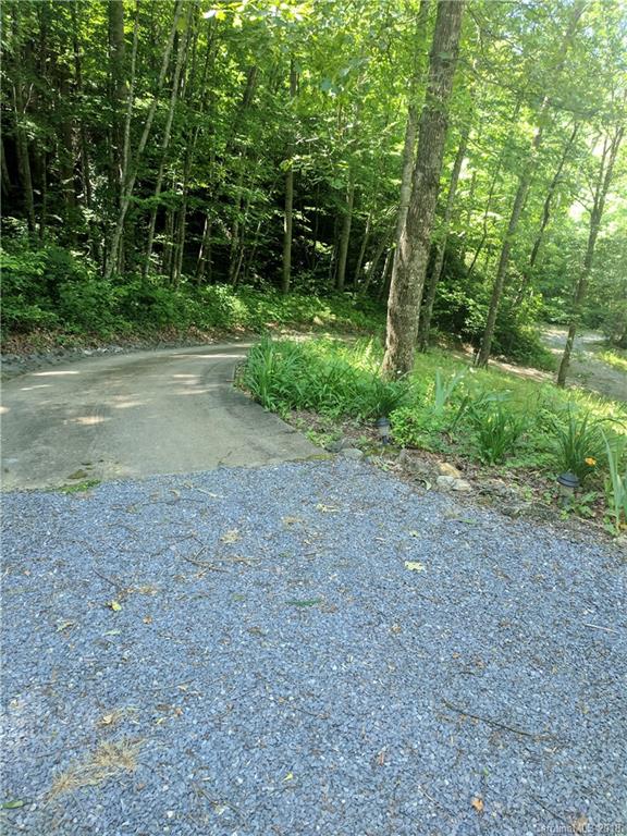 127 Dolan Lane, Unit 8338 Clyde, NC 28721 - Photo 16 of 21 a view of a field with trees in the background