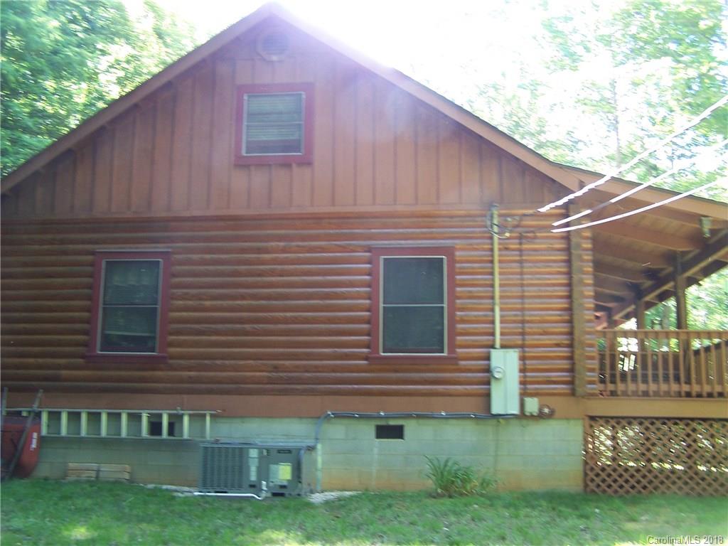 127 Dolan Lane, Unit 8338 Clyde, NC 28721 - Photo 20 of 21 a view of a house with a yard