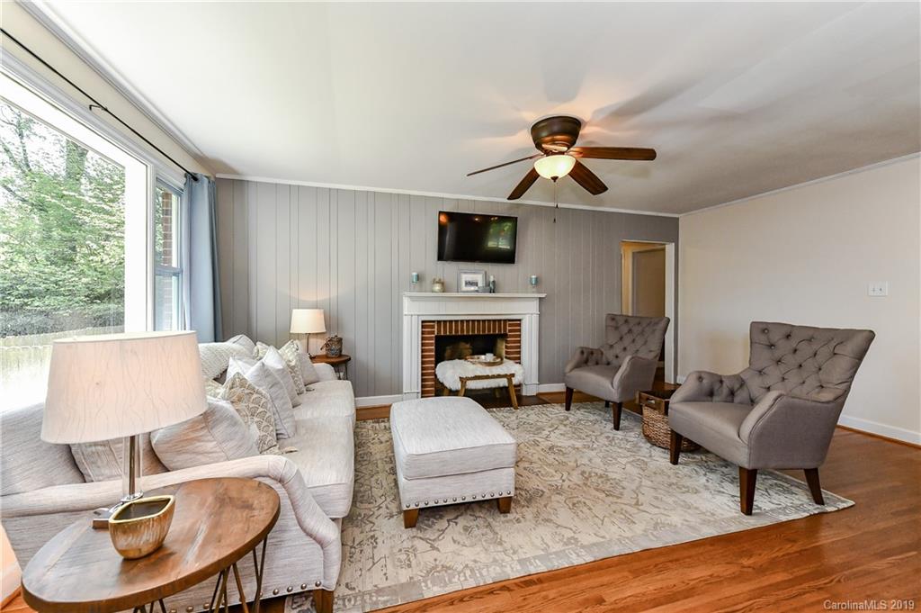 526 Scaleybark Road Charlotte, NC 28209 - Photo 14 of 37 a living room with furniture and a fireplace