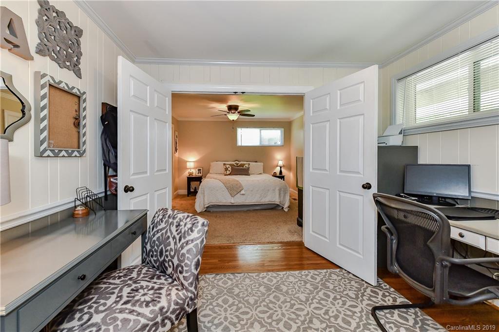 526 Scaleybark Road Charlotte, NC 28209 - Photo 17 of 37 a bedroom with furniture and a rug