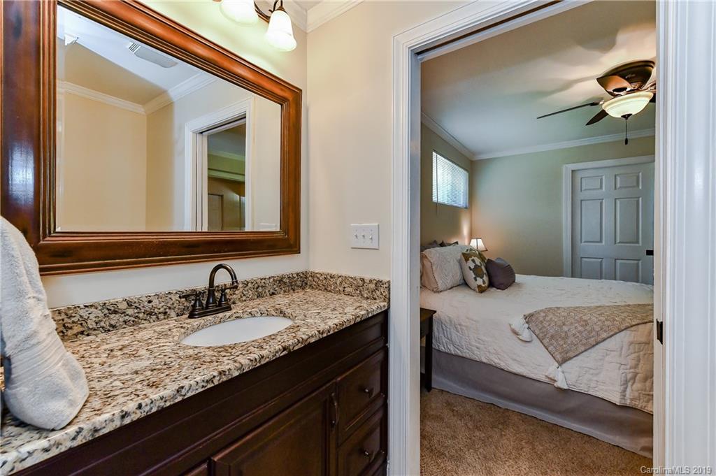526 Scaleybark Road Charlotte, NC 28209 - Photo 22 of 37 a en suite bathroom with sinks granite and a mirror