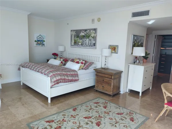 a bedroom with a bed and dresser