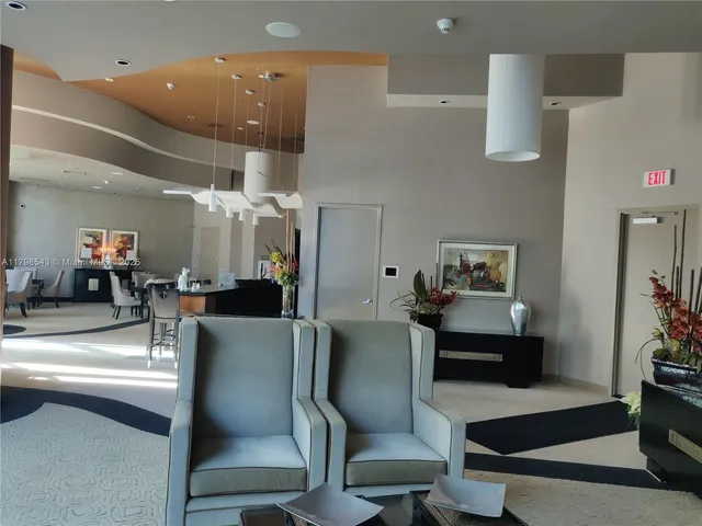 a kitchen with stainless steel appliances kitchen island granite countertop a table and chairs