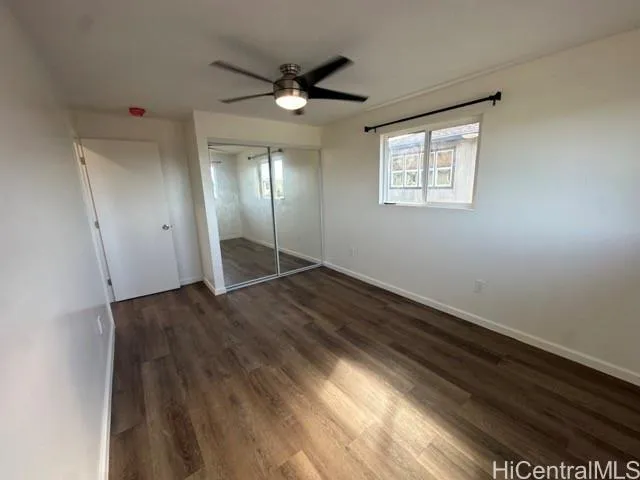 a view of an empty room and wooden floor