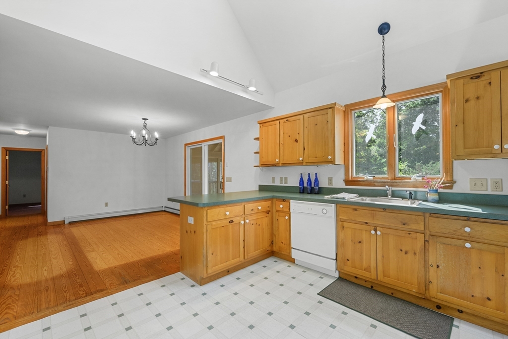 10 Appleseed Road Eastham, MA 02642 - Photo 14 of 42 a kitchen with stainless steel appliances granite countertop a sink a stove and a refrigerator