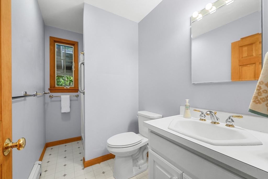 10 Appleseed Road Eastham, MA 02642 - Photo 19 of 42 a bathroom with a sink a toilet and shower