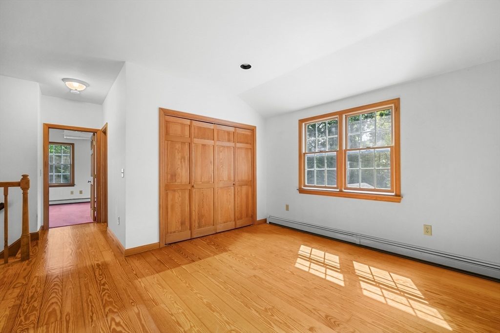 10 Appleseed Road Eastham, MA 02642 - Photo 23 of 42 a view of an empty room with window and wooden floor