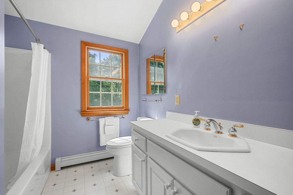 10 Appleseed Road Eastham, MA 02642 - Photo 28 of 42 a bathroom with a sink toilet and a mirror