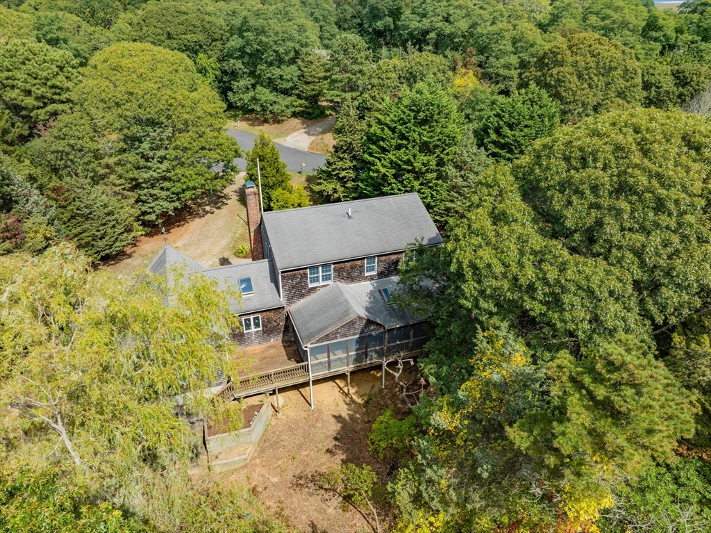 10 Appleseed Road Eastham, MA 02642 - Photo 3 of 42 an aerial view of a house with swimming pool and large trees