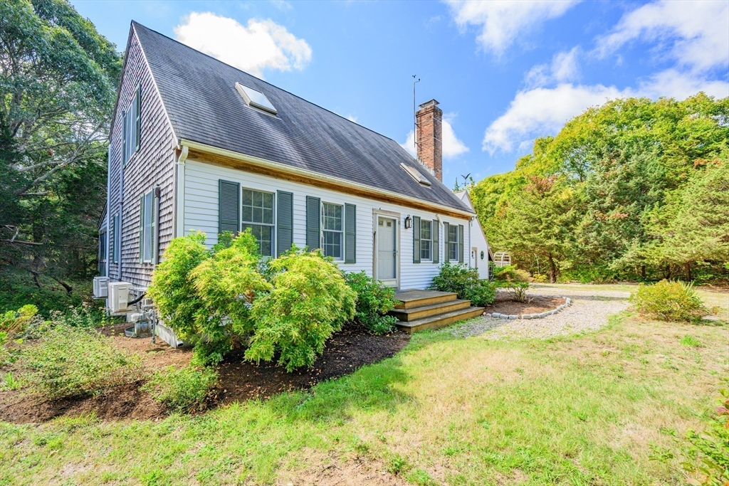 10 Appleseed Road Eastham, MA 02642 - Photo 32 of 42 a view of a house with pool and garden