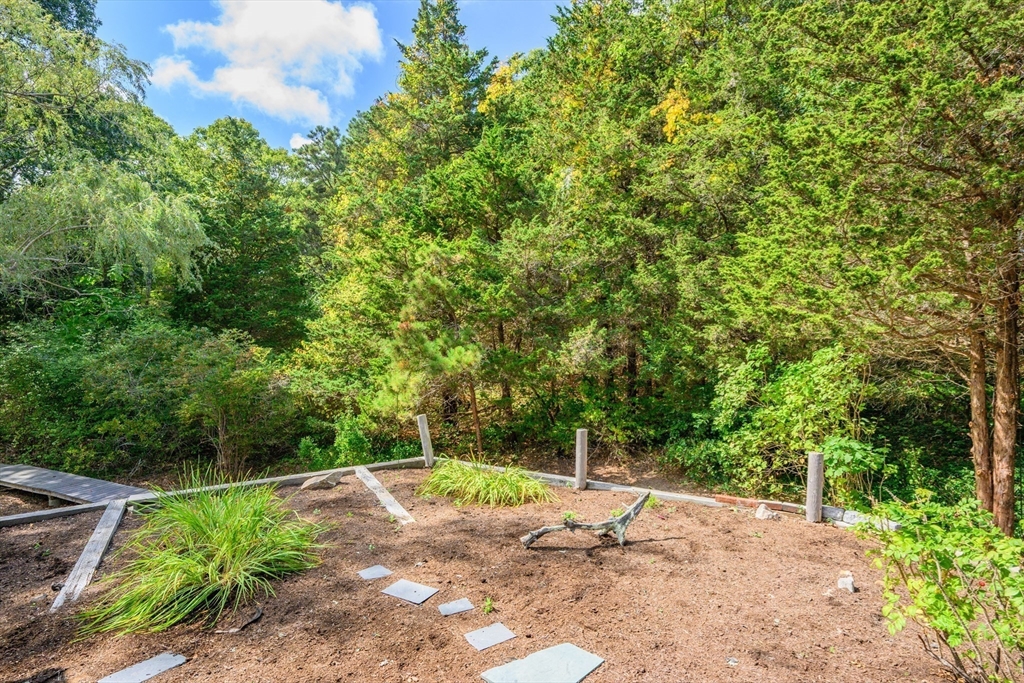 10 Appleseed Road Eastham, MA 02642 - Photo 36 of 42 a view of a dry yard with trees