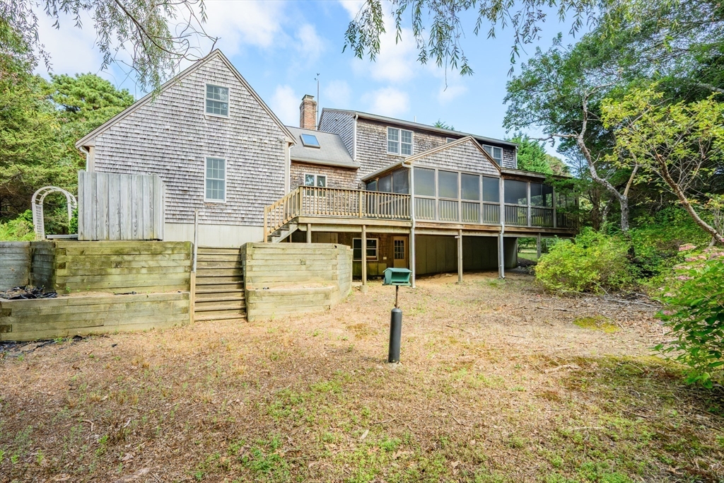 10 Appleseed Road Eastham, MA 02642 - Photo 37 of 42 a front view of a house with a yard