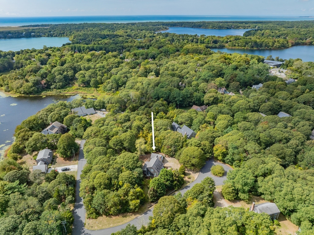 10 Appleseed Road Eastham, MA 02642 - Photo 4 of 42 a view of a green field with lots of bushes