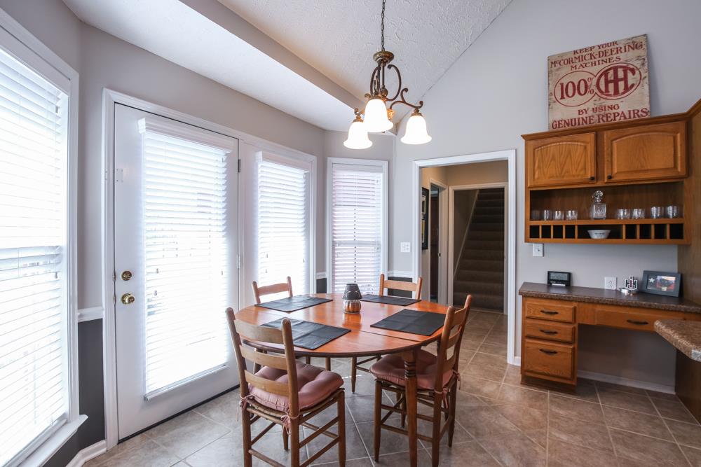 4079 Yeargan Road Murfreesboro, TN 37128 - Photo 12 of 30 a view of a dining room with furniture window and wooden floor