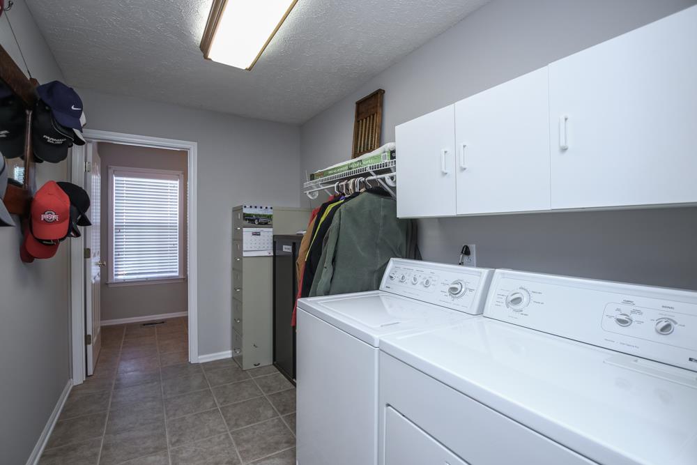 4079 Yeargan Road Murfreesboro, TN 37128 - Photo 13 of 30 a utility room with dryer and washer