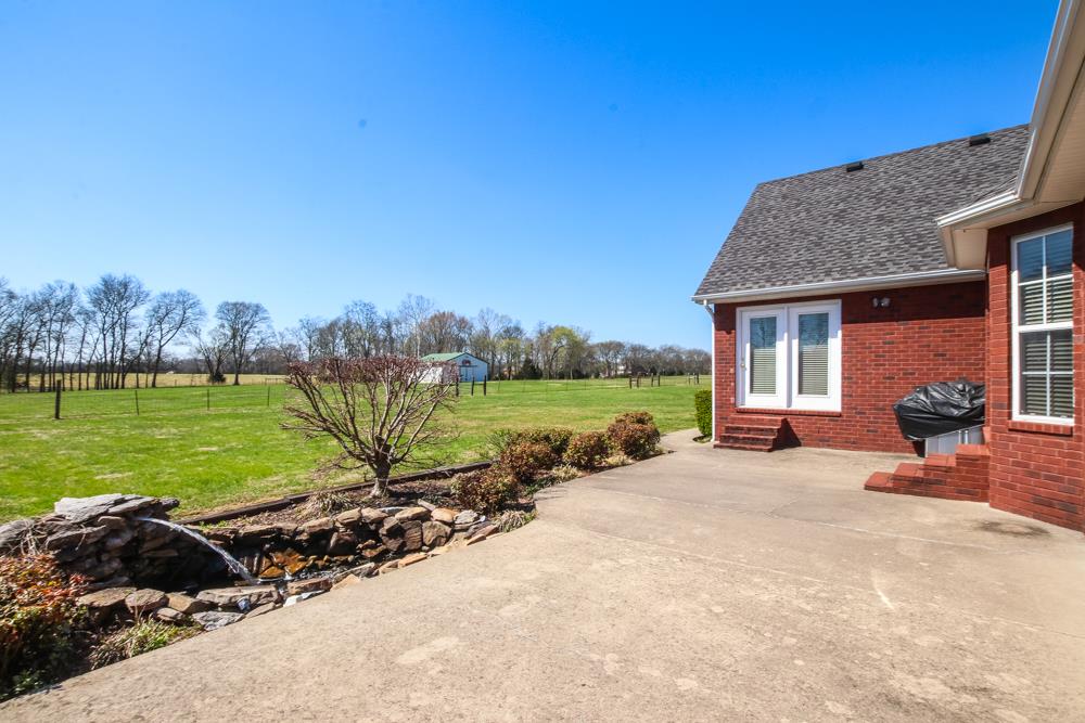 4079 Yeargan Road Murfreesboro, TN 37128 - Photo 22 of 30 a view of a house with a garden and lake view