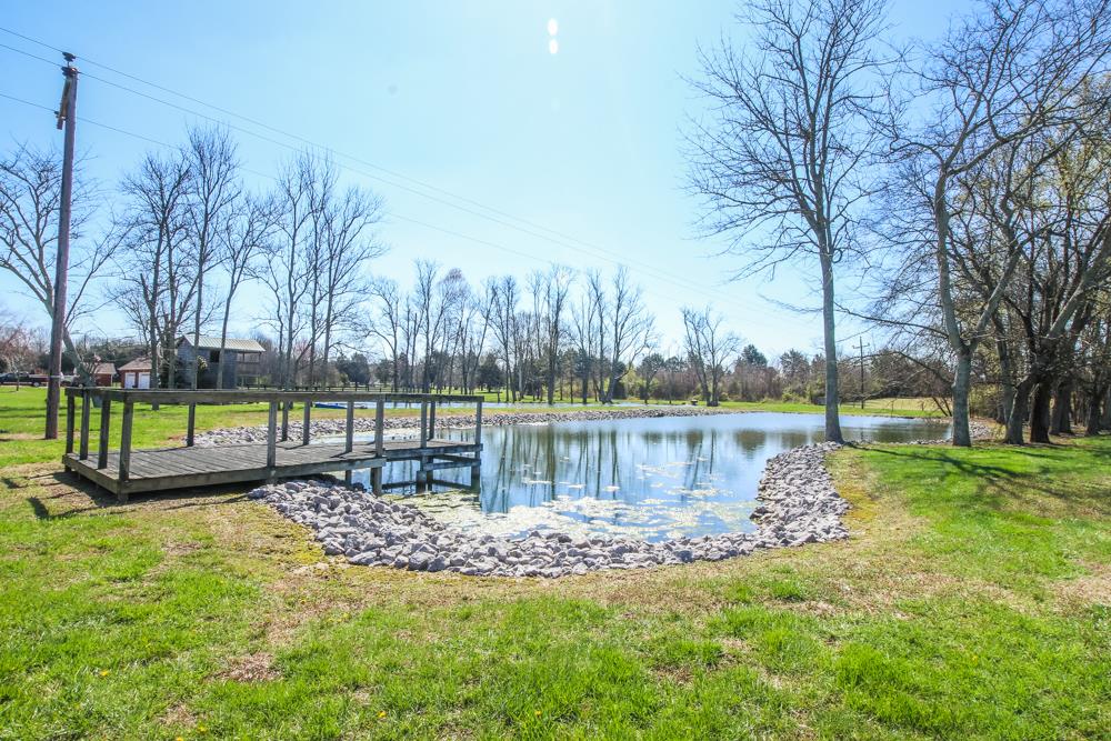 4079 Yeargan Road Murfreesboro, TN 37128 - Photo 24 of 30 a view of a lake with houses with yard