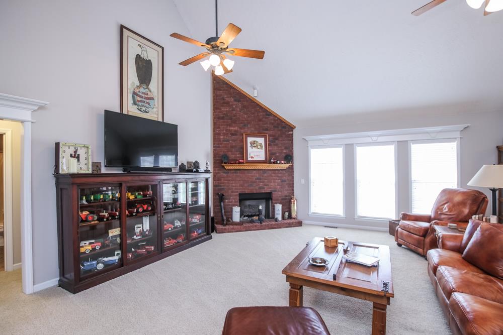 4079 Yeargan Road Murfreesboro, TN 37128 - Photo 6 of 30 a living room with fireplace furniture and a flat screen tv