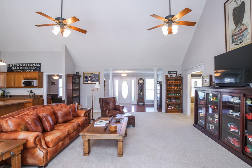 4079 Yeargan Road Murfreesboro, TN 37128 - Photo 7 of 30 a living room with furniture a ceiling fan and a window