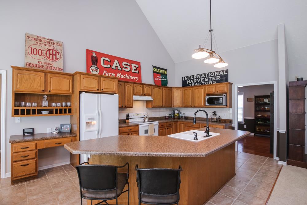 4079 Yeargan Road Murfreesboro, TN 37128 - Photo 10 of 30 a kitchen with stainless steel appliances granite countertop a sink a stove and a refrigerator