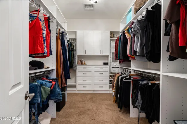 a bathroom with a granite countertop sink mirror and tub