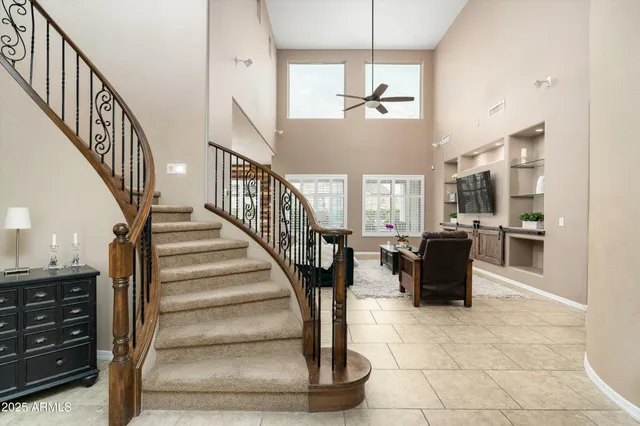 an aerial view of a houses with a city view
