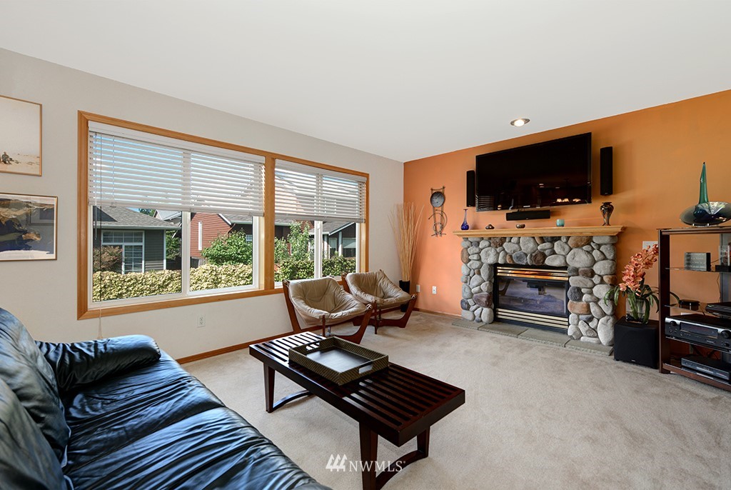 19014 33rd Avenue Southeast Bothell, WA 98012 - Photo 14 of 23 a living room with furniture and a flat screen tv