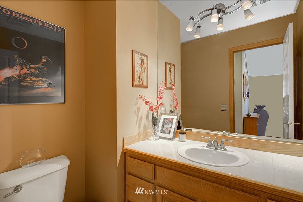 19014 33rd Avenue Southeast Bothell, WA 98012 - Photo 18 of 23 a bathroom with a granite countertop sink mirror and toilet