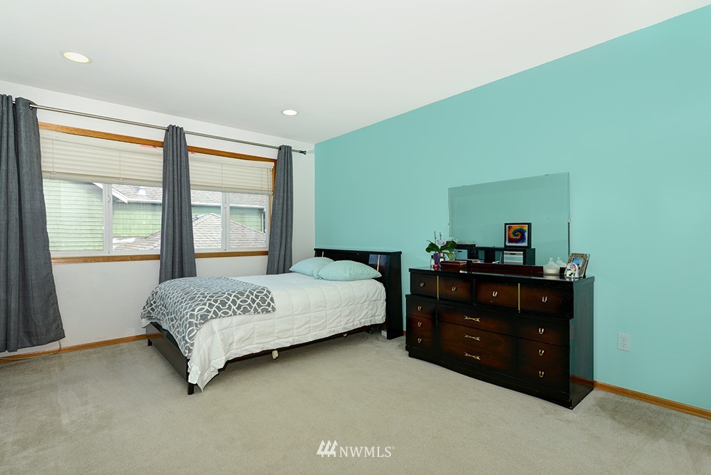 19014 33rd Avenue Southeast Bothell, WA 98012 - Photo 20 of 23 a bedroom with a bed and a window