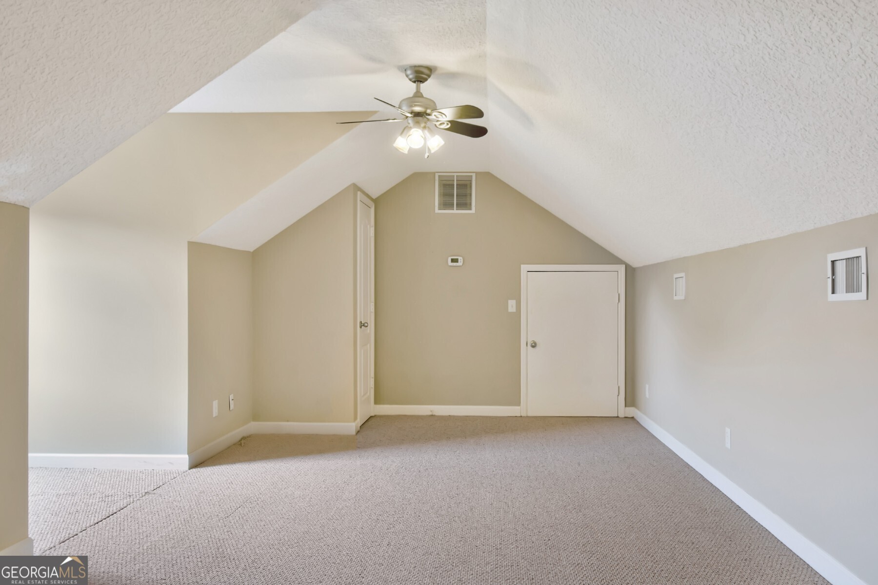 138 Arlington Way Brunswick, GA 31523 - Photo 22 of 32 a view of an empty room with a fan