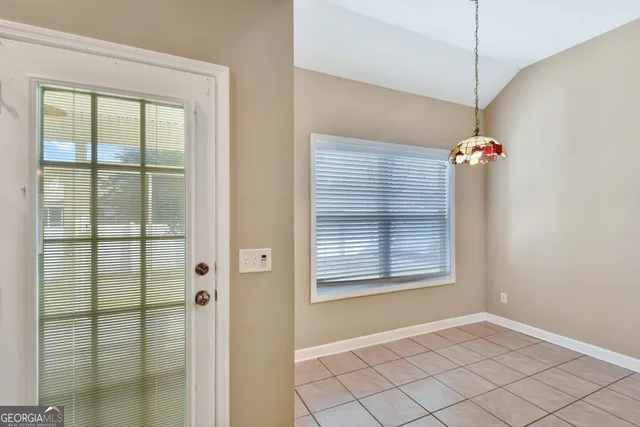 a view of a chandelier fan and windows