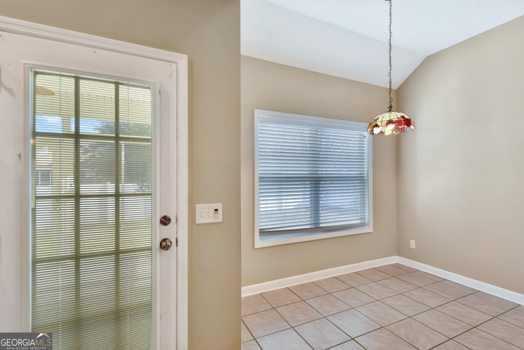 138 Arlington Way Brunswick, GA 31523 - Photo 8 of 32 a view of a chandelier fan and windows
