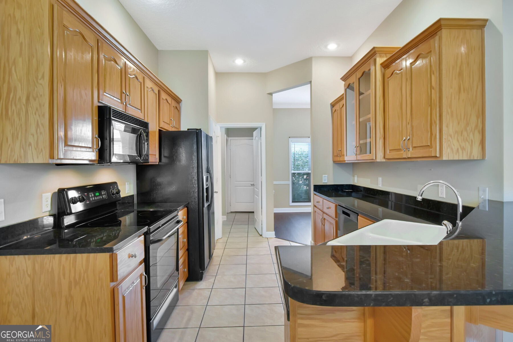 138 Arlington Way Brunswick, GA 31523 - Photo 10 of 32 a kitchen with stainless steel appliances granite countertop a stove a refrigerator a sink and dishwasher