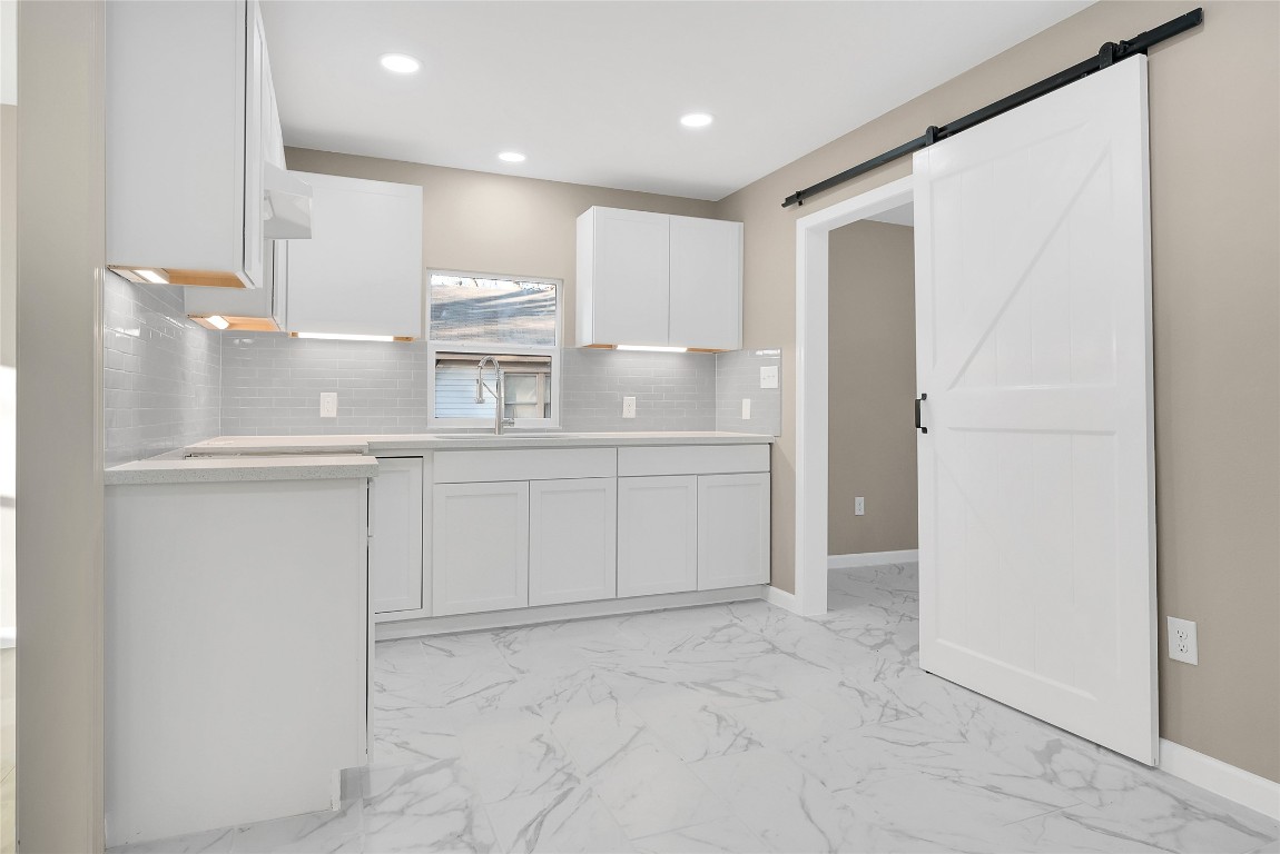 408 North Speed Street Wharton, TX 77488 - Photo 6 of 11 a view of a kitchen with white cabinets