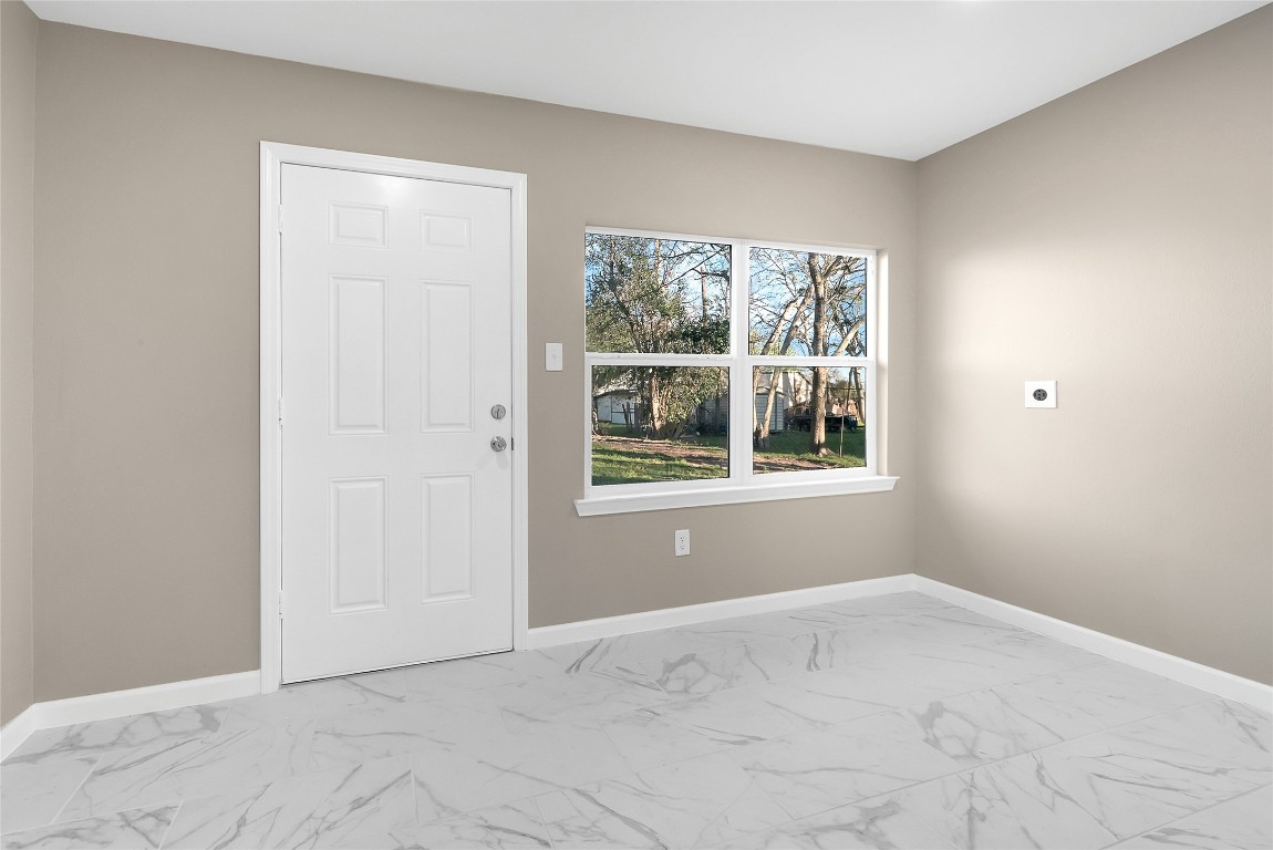 408 North Speed Street Wharton, TX 77488 - Photo 10 of 11 a view of an empty room with a window