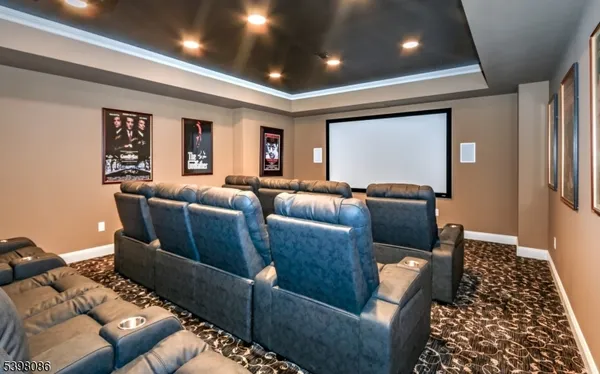 a media room with lots of chairs and a projector